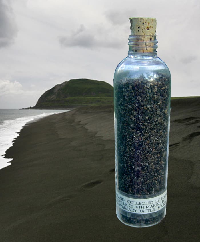 A vial of sand from the beach at Iwo Jima. You can see that Mt. Suribachi is a bit greener now than during the battle.