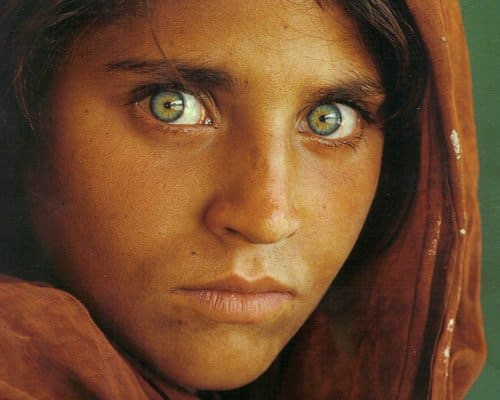 The famous "Afghan Girl" National Geographic cover featured Sharbat Gula, a young woman with naturally green eyes.