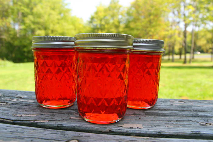 Candy Apple Jelly is beautiful and tastes like baked cinnamon apples. This is an excellent homemade gift during the holiday season!
