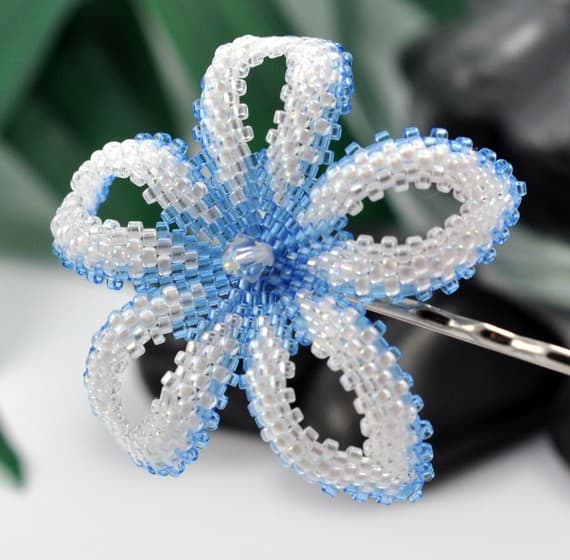 This is a beautiful example of a blue and white bead-woven flower. Learn to make your own!