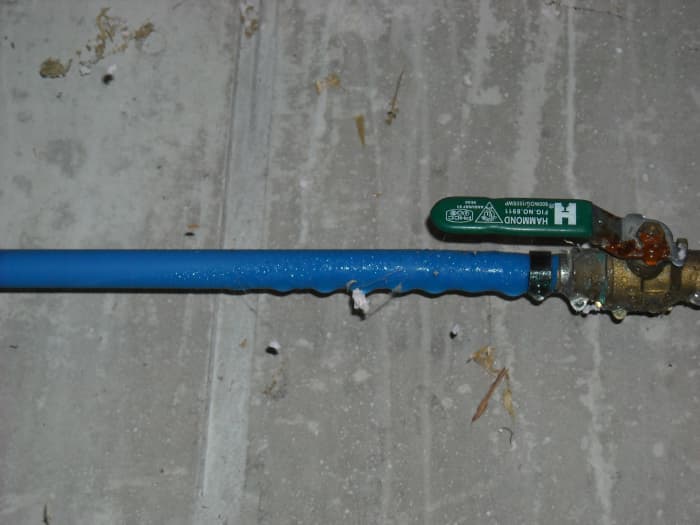 The PEX tubing and brass ball valve were sweating substantially in a basement that the building owner wanted to finish but couldn't until this issue was corrected.