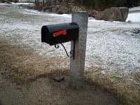 Notice the rock at the bottom of the mailbox post. This was the second hit and it's still standing :)