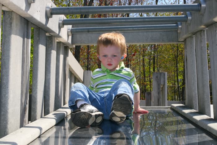 An outdoor playground gives children the opportunity to develop various gross motor and social skills.