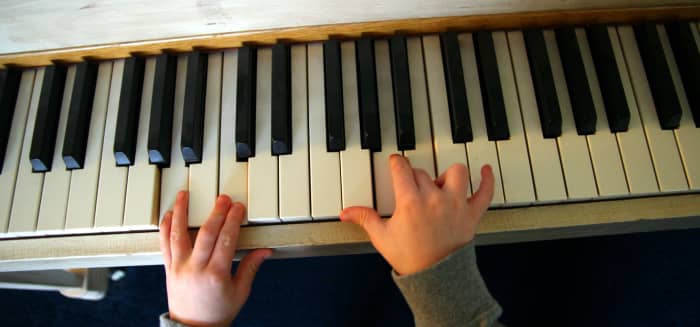 A child should show an interest in music and the piano before enrolling in formal lessons.