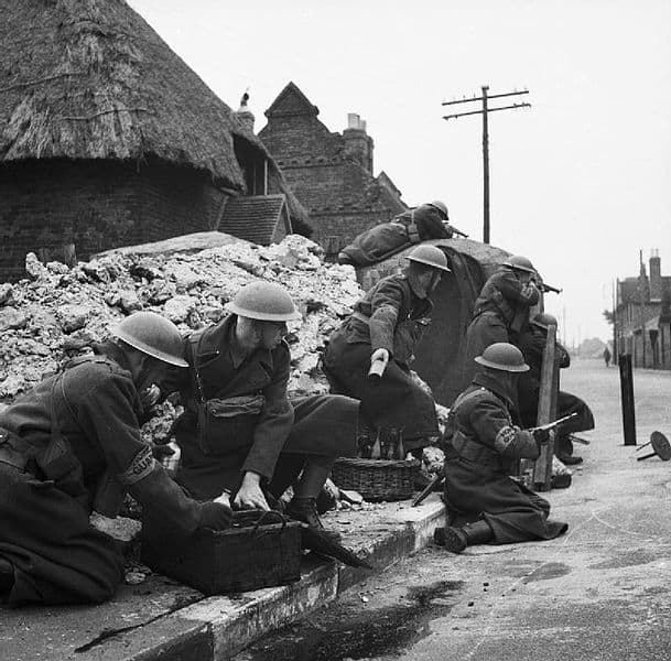 Home Guard soldiers training to defend a street with Molotov cocktails. Circa March 1941.