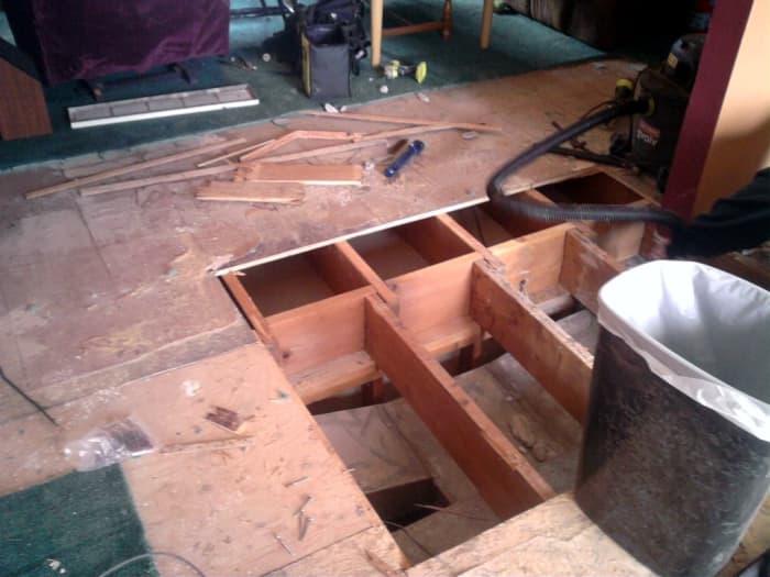 This subfloor was in very poor condition, and parts had to be replaced. The entire floor was then covered with a second layer.