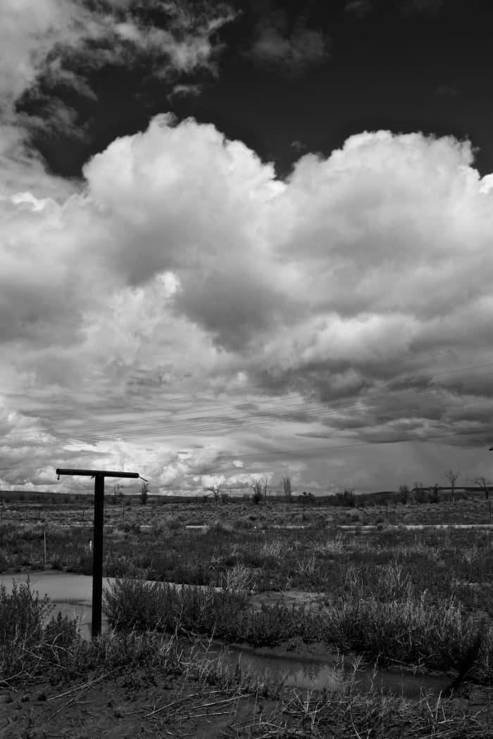 Clothesline poles occasionally dot the landscape, one of a very few indications that this was once a town.