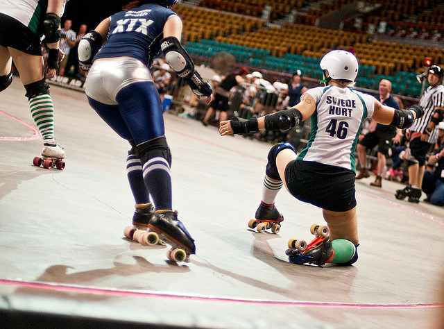 Roller derby skater taking a knee