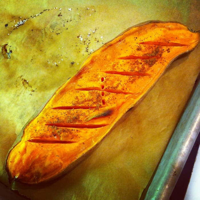 A roasted sweet potato. You can tell it's a sweet potato because of the orange interior flesh. This is one of two types of sweet potatoes sold in US markets.
