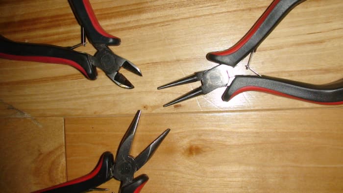 Close-up of nose - Left to right from top: Cutter, Round-nose pliers, Chain-nose pliers.