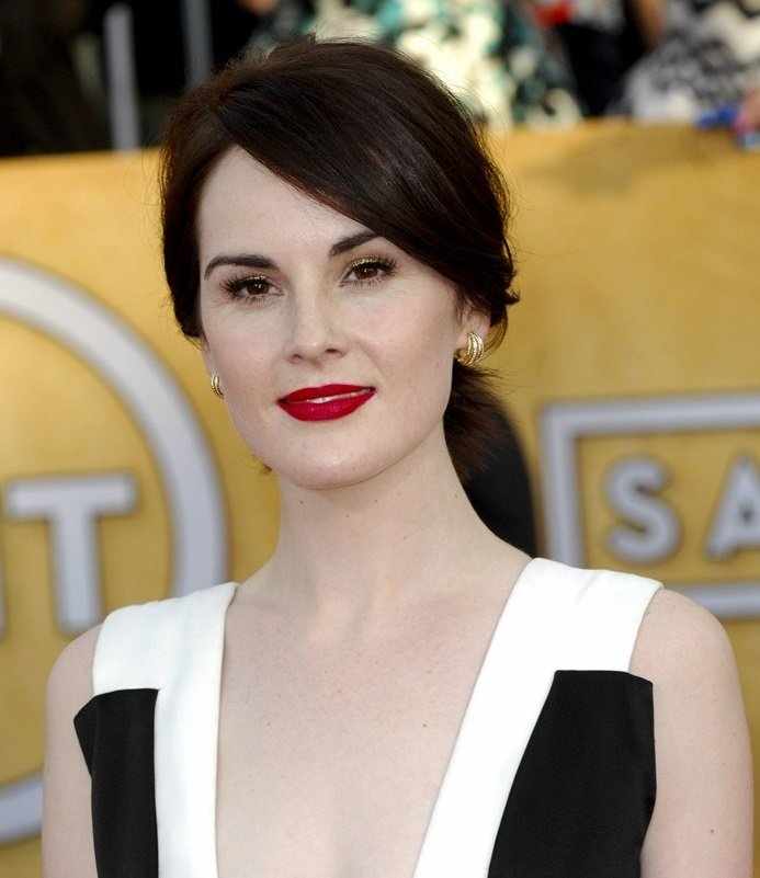 Michelle Dockery with dark red lipstick and alabaster skin
