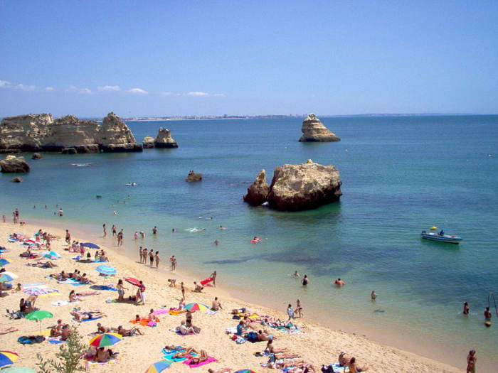 A Lisbon road trip can take you to the beaches of Lagos, Portugal.