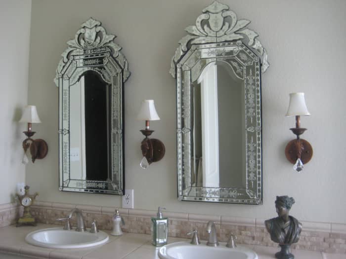 Replace a boring plate-glass mirror with something beautiful, fun or exciting. I love Venetian glass mirrors, as they provide plenty of lovely sparkle and elegance, much like a crystal chanedlier does.