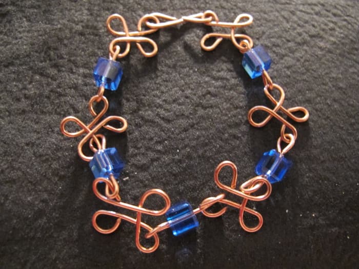 I like to use a dark background for my jewelry at fairs. It looks glamorous and helps the colors pop.