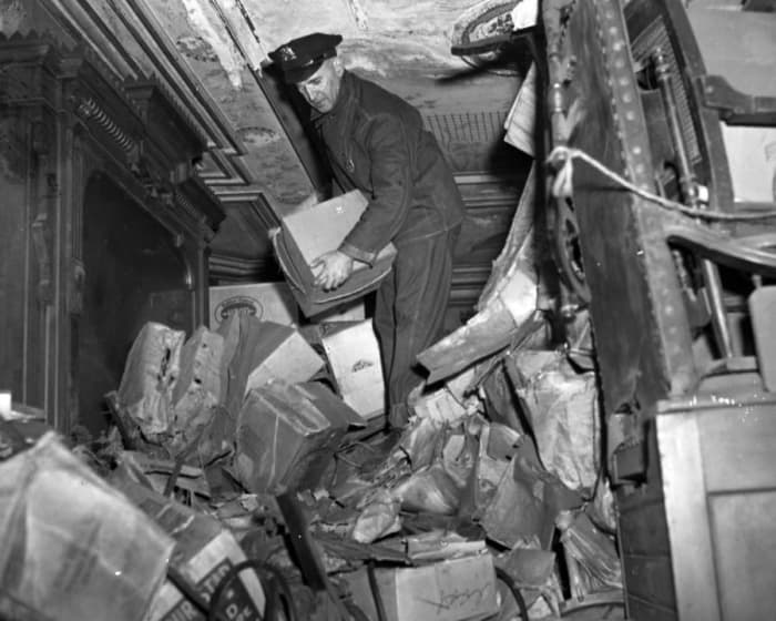 Using an ax, police broke down the barricades of a once-elegant Harlem brownstone that the Collyer brothers occupied for 20 years, and found their extreme clutter in March 1947, along with a dead man.