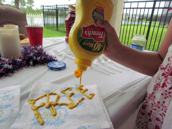 Thomas Jefferson as Mustard, writing the Declaration of Independence. If you have the big fancy napkin, because you wanted to impress your family and friends this holiday with your tableware, you can write the whole word, "FREEDOM."