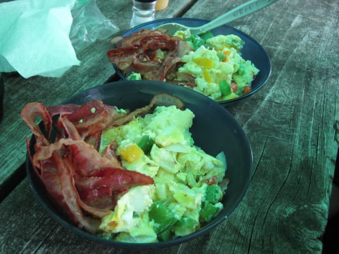 Add a few strips of bacon to your omelet scramble for a breakfast that will take you miles to hike off.