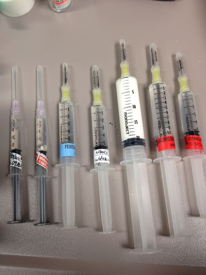 Some of the intravenous medications that may be used during general anesthesia. Propofol is shown in the white syringe. Because of its color and ability to induce unconsciousness, it has been given the nickname "milk of amnesia."