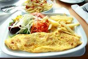 Add chicken to omeletes