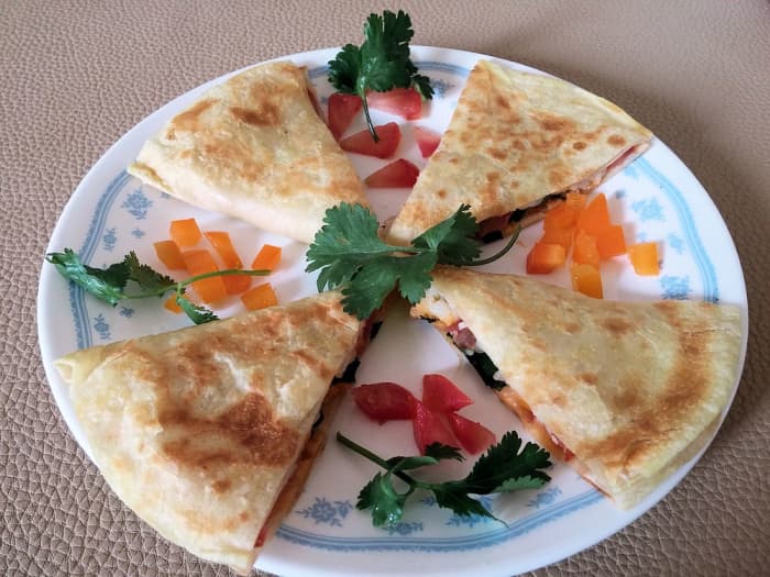 Use flour or corn tortillas, stuff them with whatever you like, and cook for 2 to 4 minutes in a quesadilla maker. Don't forget the cheese!
