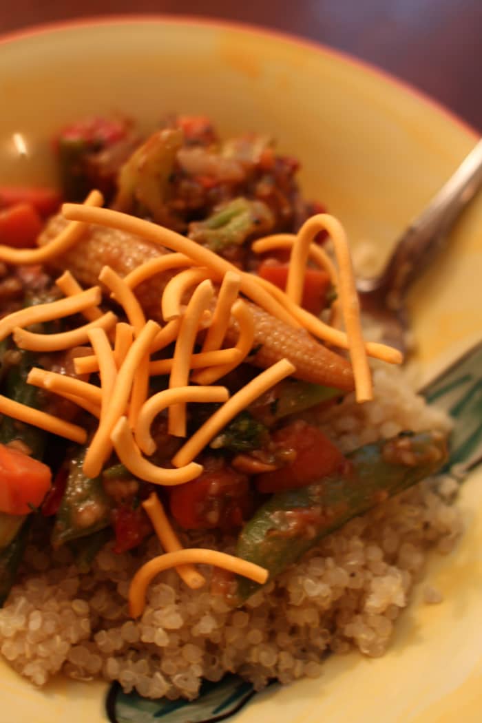 Becoming a veg-head can be as easy as making this delish dish out of some quinoa, frozen veggies, peanut sauce, and chow mein noodles.