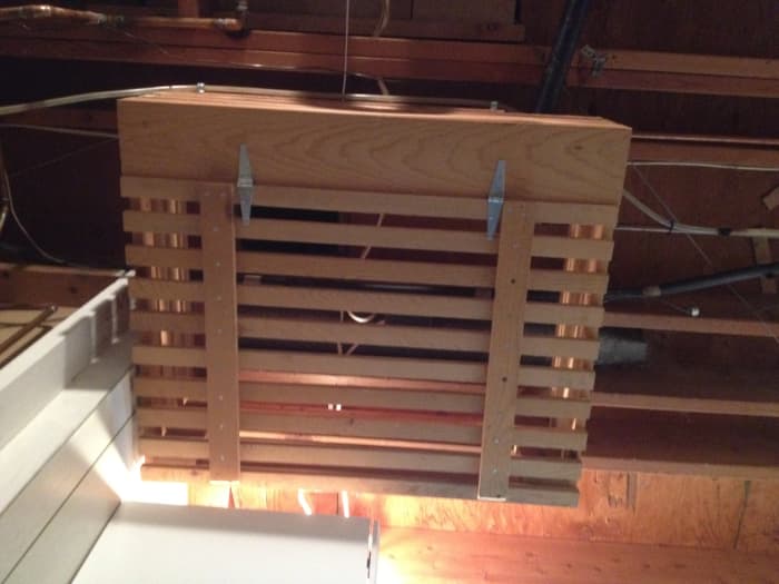 Install a laundry chute in the floor. This is the view looking up from the laundry room to the box we built to catch the laundry from above.