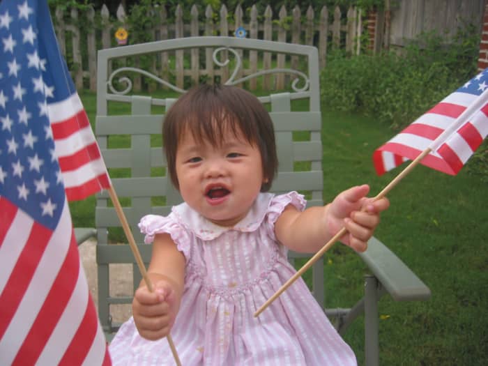 My adopted daughter (who had just become an American citizen) loved waving the American flags on her first 4th of July celebration.