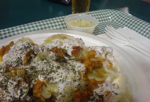 A plate of the completed Afghan mantu with sauces.