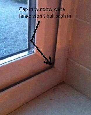 Gap in window where hinge won't close the sash fully.