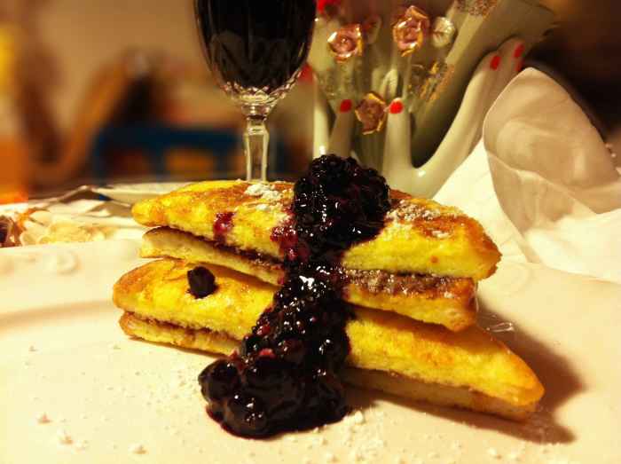 Hot Nutella sandwich dobbed with hot fruit of the woods.