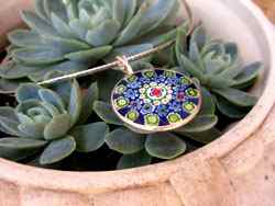 You can find some really beautiful millefiori pendants online, like this one I bought last year.