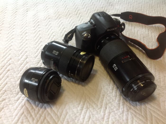 My Sony Alpha DSLR and three prime, Minolta Maxxum lenses. 50mm f1.7, 100-200mm f4.5, 70-210mm f4 "The Beercan"