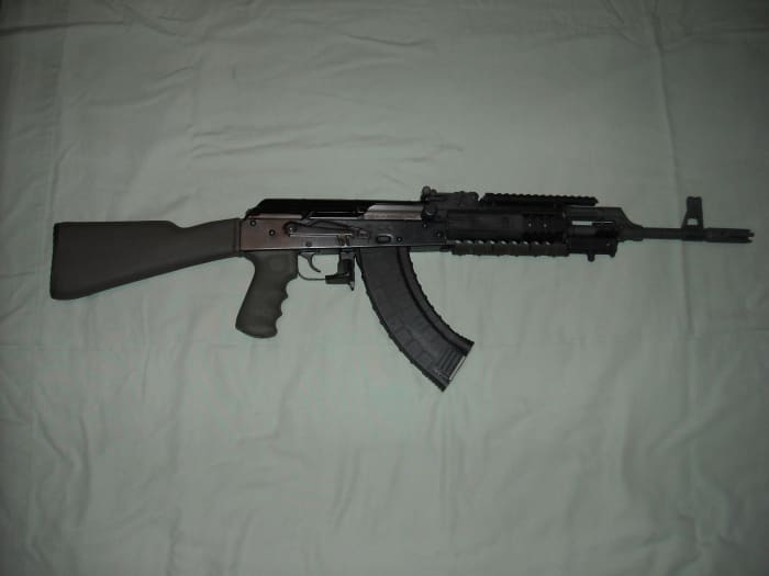 Fully assembled AK-47. Remove magazine, take weapon off of safe and clear the chamber of any ammunition.