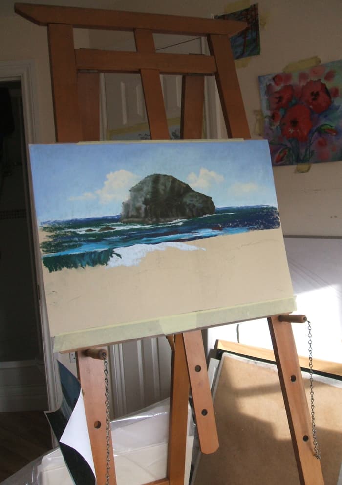 My school easel with the half-finished painting of Lifeguards Relaxing At Trebarwith Strand.