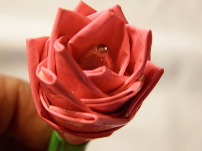 This one is made on a gel pen. You can use any pen or a straw for the stem. All you need is at least 16 inches of any color duct tape and scissors. You need about 6 inches of green duct tape for the stem.
