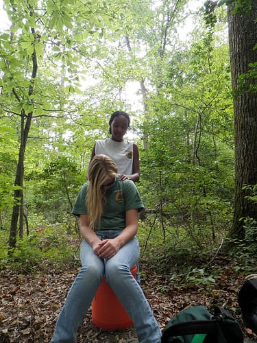 You can give a good massage wherever you go, whether it's camping like these young ladies or at home.