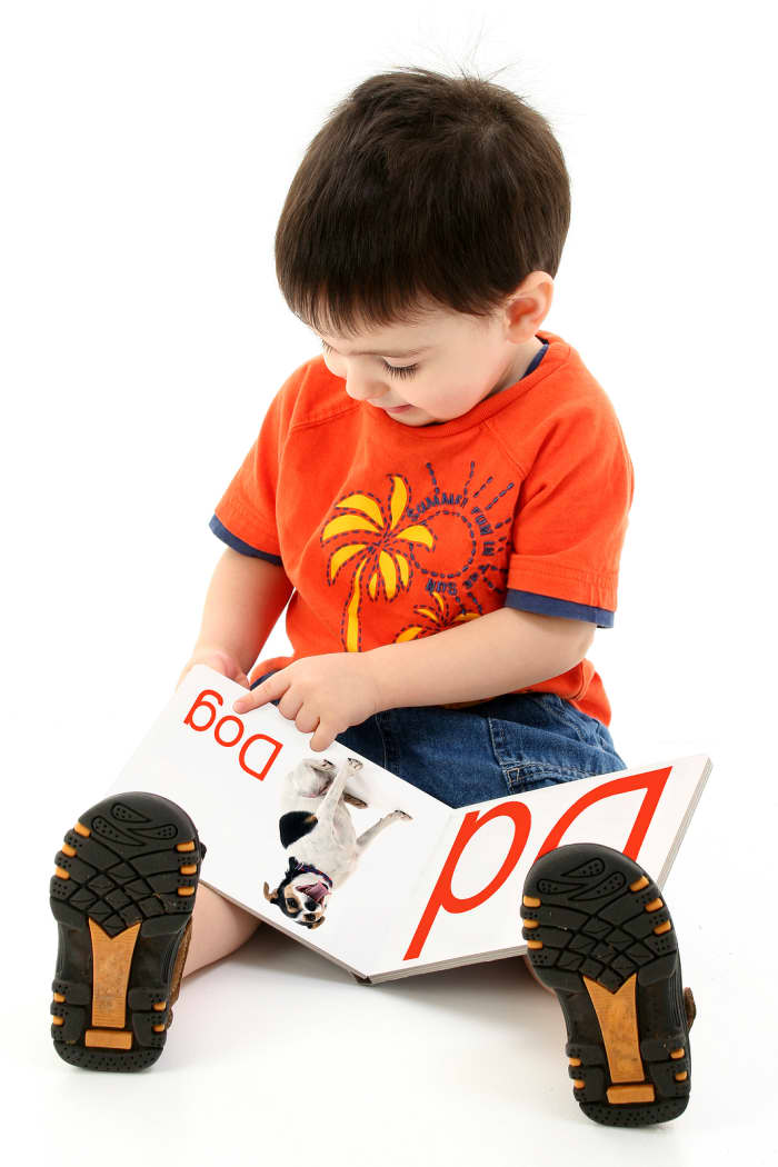 Even turning a page takes considerable skill. This is an example of a toddler's fine motor skills in action.