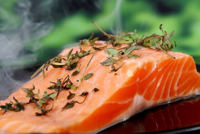 A stomach enzyme called pepsin needs an acidic environment in order to digest protein. Fish, meats, eggs, dairy, and beans are all rich in protein.
