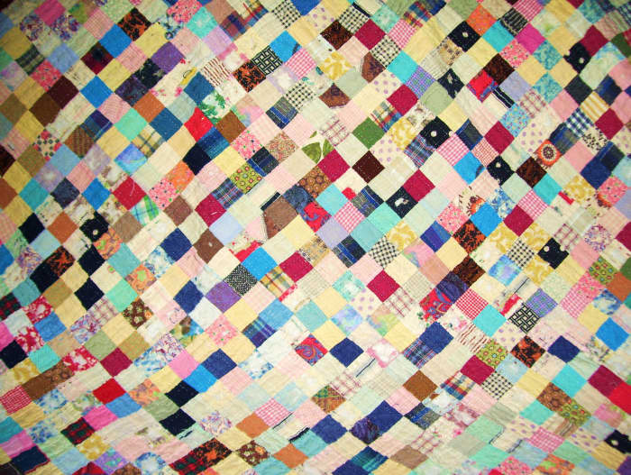 The quilt that has been around the world. It accompanied my father everywhere in his twenty years of naval service. Squares are 1 inch.