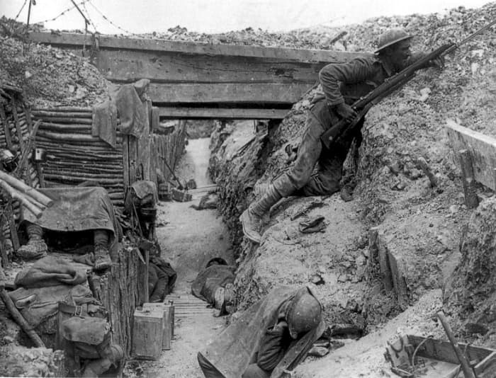 A photo of British troops from the 11th battalion of the Cheshire Regiment stationed in a trench near the Somme River.