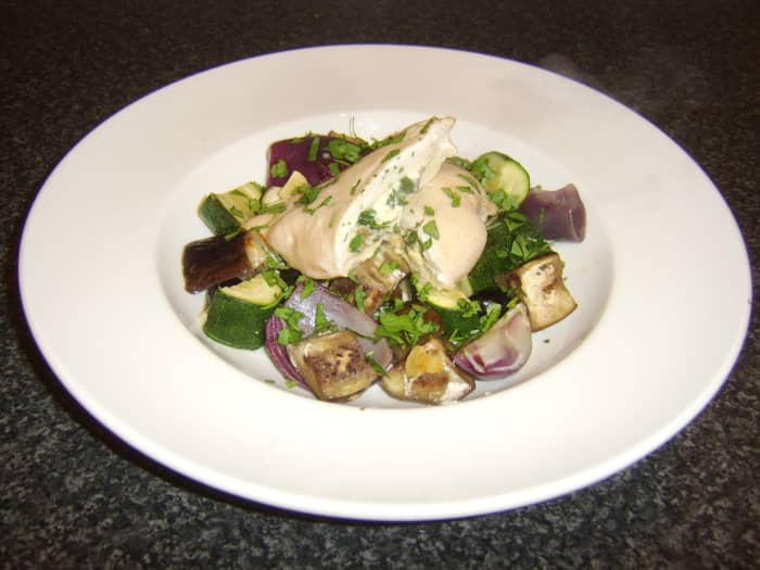 Chicken breast stuffed with feta cheese, porcini mushrooms, and spinach, served with roasted Mediterranean vegetables