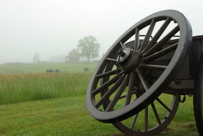 Near the main entrance are a series of cannons and wagons. The old house in the background is an important feature in the movie they play inside. If you look closely, you can see it in the foggy distance.
