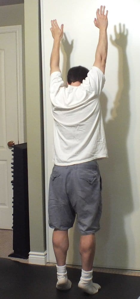You can stretch while standing by extending your arms as high as they will go and standing on your tiptoes.