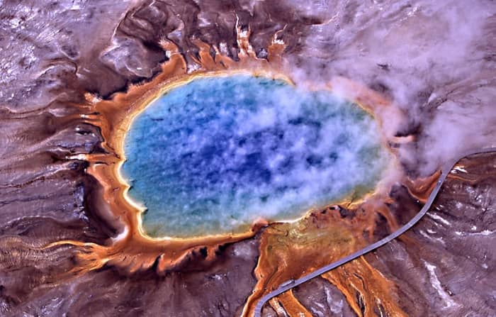 Grand Prismatic Spring, Yellowstone National Park: the orange area is made of thermophilic microbes that contain orange pigments called carotenoids.