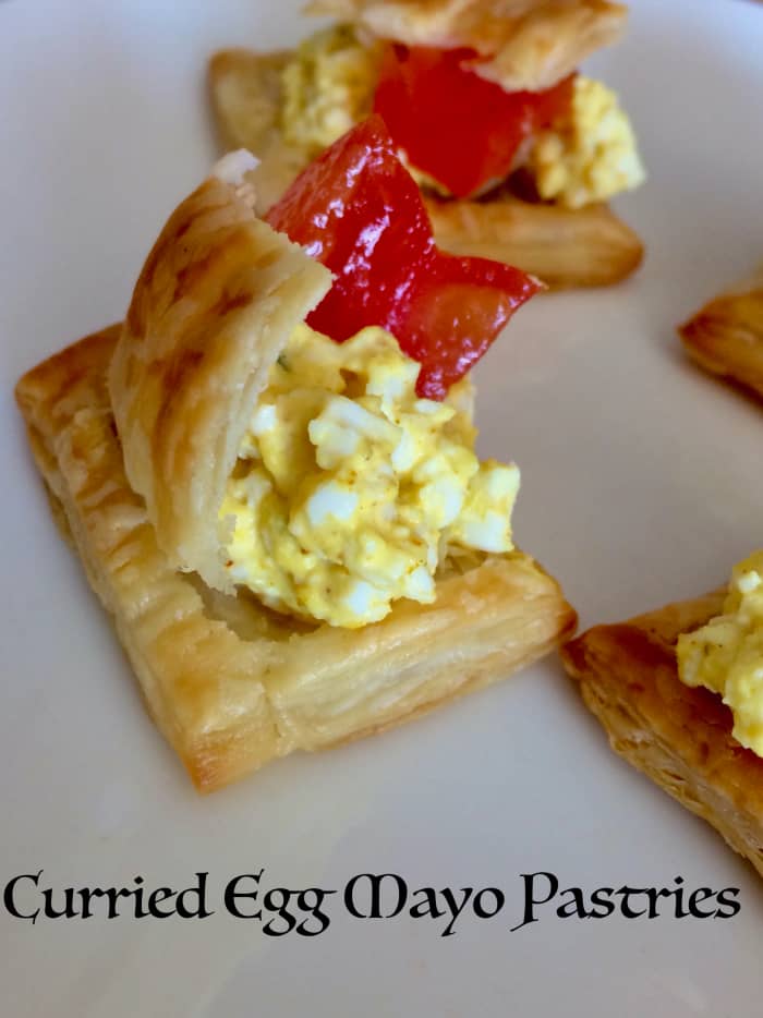 Learn how to make four different kinds of puff pastry tarts with these easy-to-follow recipes. This is a curried egg mayo pastry.