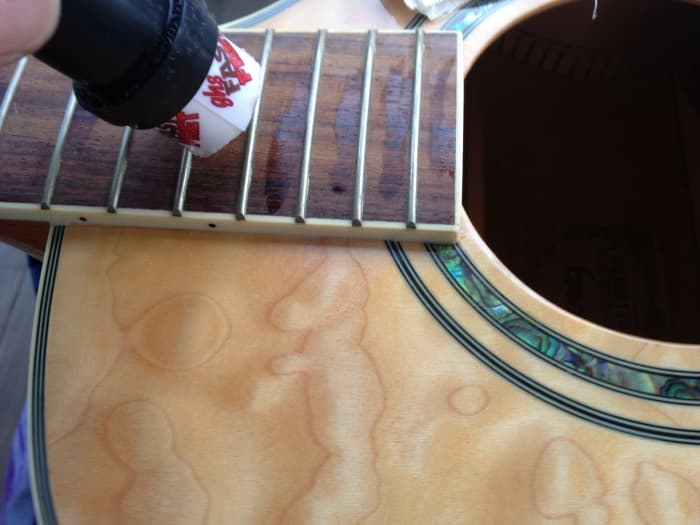 Cleaning up your guitar is a snap when the strings are out. Every time you re-string your guitar is the perfect time to polish.