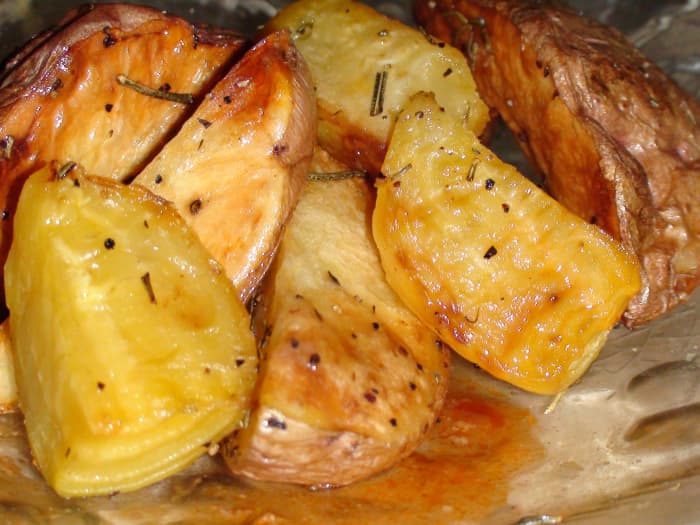 A plate of sweet golden beets and red potatoes with olive oil and rosemary topped with a bit of lamb gravy is delicious!