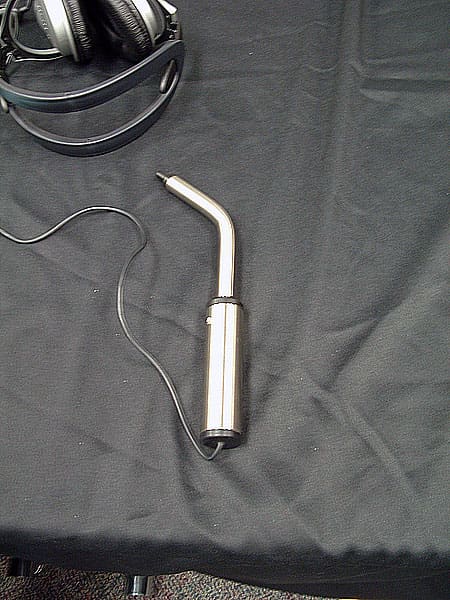 This is a sip-and-puff device, sometimes called a puff mouse, which allows a person with a disability to control computer interface screens by blowing and inhaling into the device.