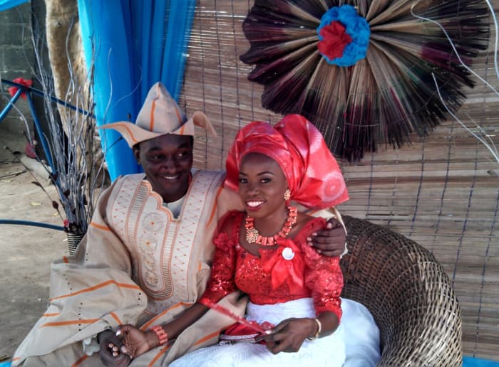 Meet the bride and groom! The groom is in the Agbada (Dashiki) outfit with the doggy-ears styled cap (Fila Abeti Aja). The Bride donned her Ibo Traditional Attire.
