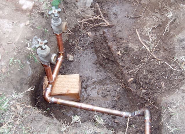 Elbows join different levels of piping. With this sprinkler pipe redesign, two copper pipes on different levels had to be soldered together with two elbows. Changing directions also requires soldering an elbow.